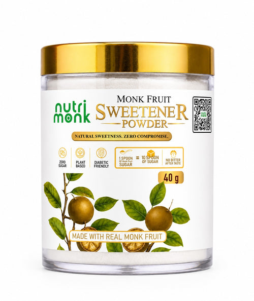 A jar of Nutri Monk Sweetener Powder with a gold metallic lid and a white label featuring green and gold text, illustrations of monk fruit, and a QR code on a white background.